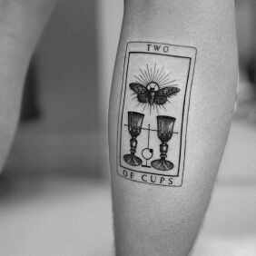 Tattoo Tarot card on the leg motif: black and gray style: graphic / illustrative