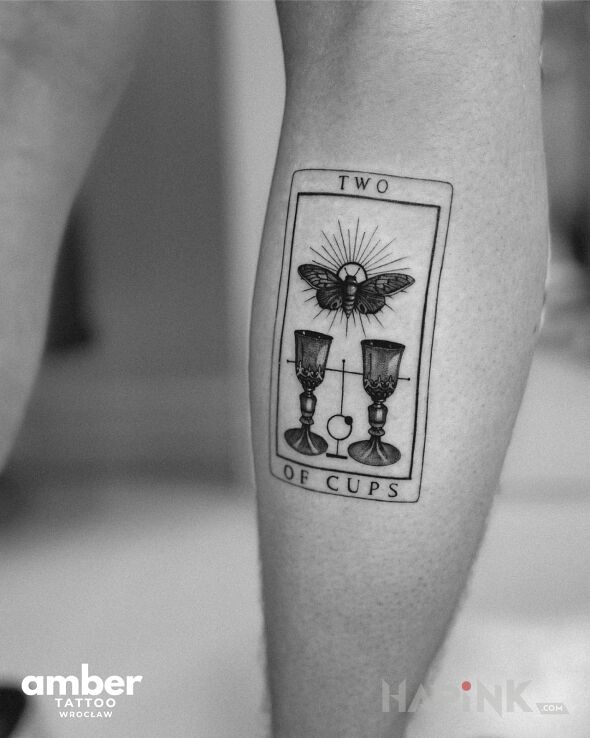 Tattoo Karta tarota in black and gray motif and graphic / illustrative style on the calf