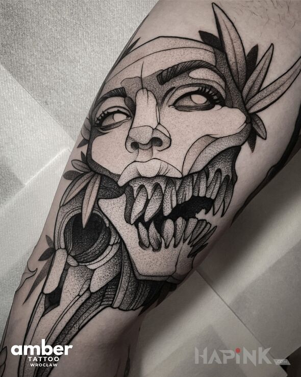 Tattoo Amber Tattoo in faces motif and dotwork style on the leg