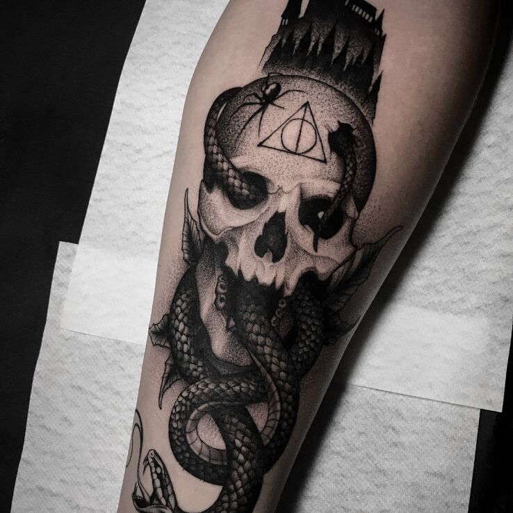 Tattoo Death Eater in black and gray motif and dotwork style On the arm