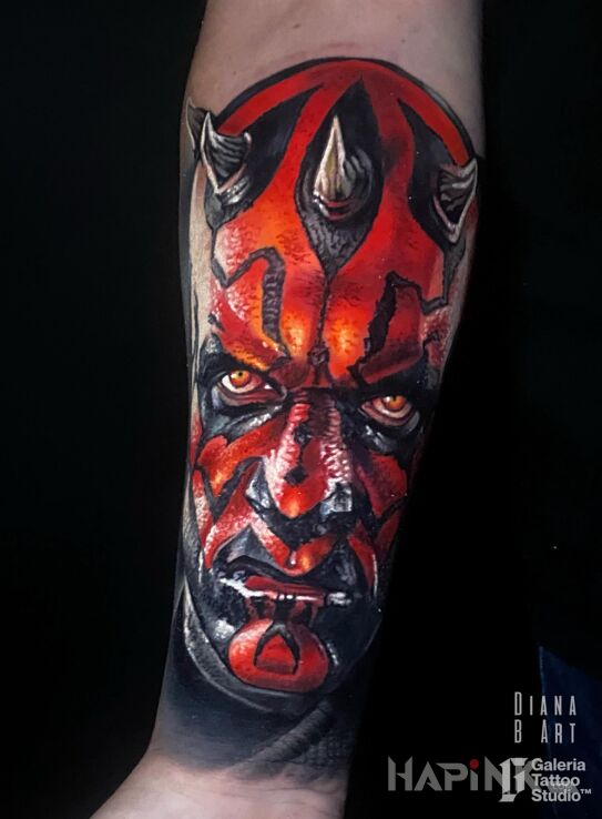 Tattoo Darth Maul Star Wars in characters motif and realistic style on the forearm