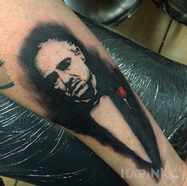 Tattoo Godfather in characters motif on the forearm