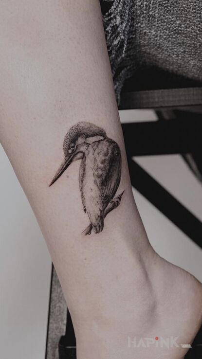 Tattoo Microrealism in nature motif and realistic style near the ankle