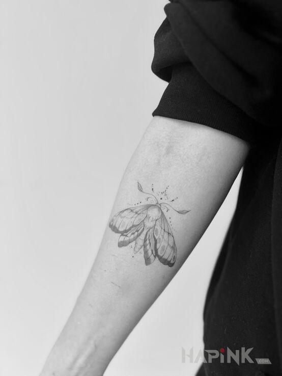 Tattoo Ćma in insects motif and graphic / illustrative style On the arm