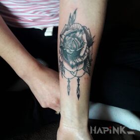 Tattoo Rose on the forearm motif: flowers