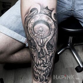 Tattoo Clockwork chequered on the forearm motif: skulls