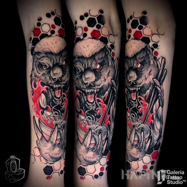 Tattoo Ratel Miodożerny Ramen in black and gray motif and trash polka style On the arm