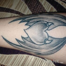 Tattoo Heart with wings On the arm motif: wings style: graphic / illustrative