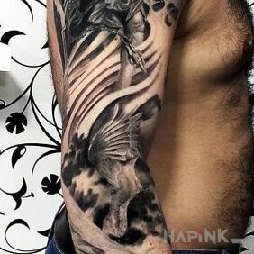Tattoo Angelically on the upper arm motif: angels