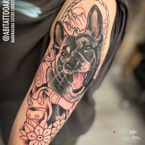 Tattoo First session of a puppy portrait on the upper arm motif: colorful style: neo-traditional