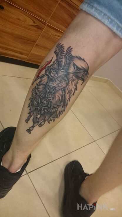 Tattoo Pogromca in patriotic motif on the calf