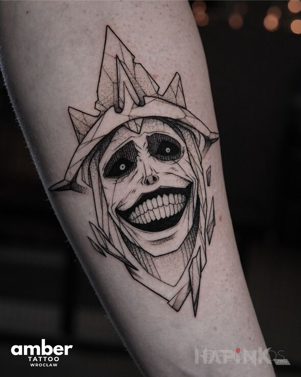 Tattoo Potworny uśmiech in black and gray motif and graphic / illustrative style on the forearm