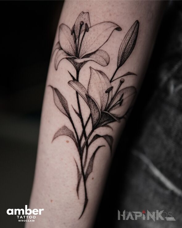 Tattoo Kwiaty dwa in black and gray motif and realistic style on the forearm