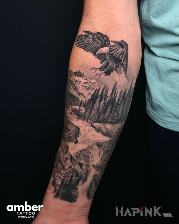 Tattoo Górski krajobraz z orłem in black and gray motif and realistic style on the forearm