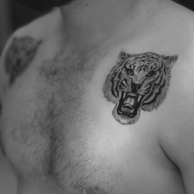 Tattoo Cage tiger in animals motif and graphic / illustrative style on the chest