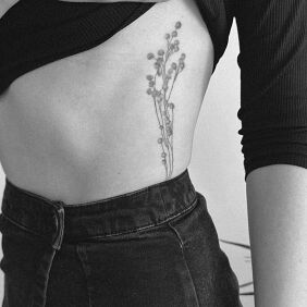 Tattoo Flowers from the field on the ribs motif: black and gray style: graphic / illustrative