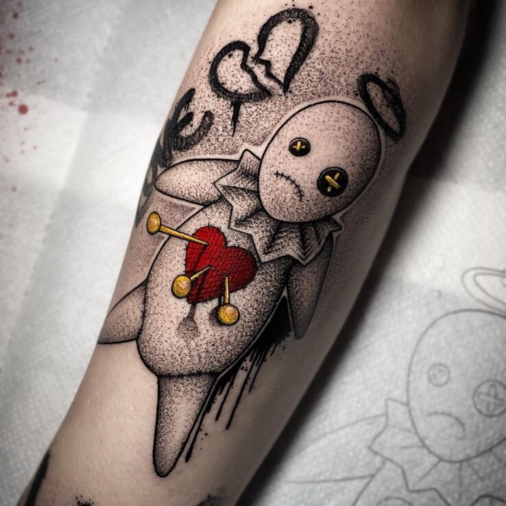 Tattoo Voodoo Doll in black and gray motif and dotwork style on the forearm