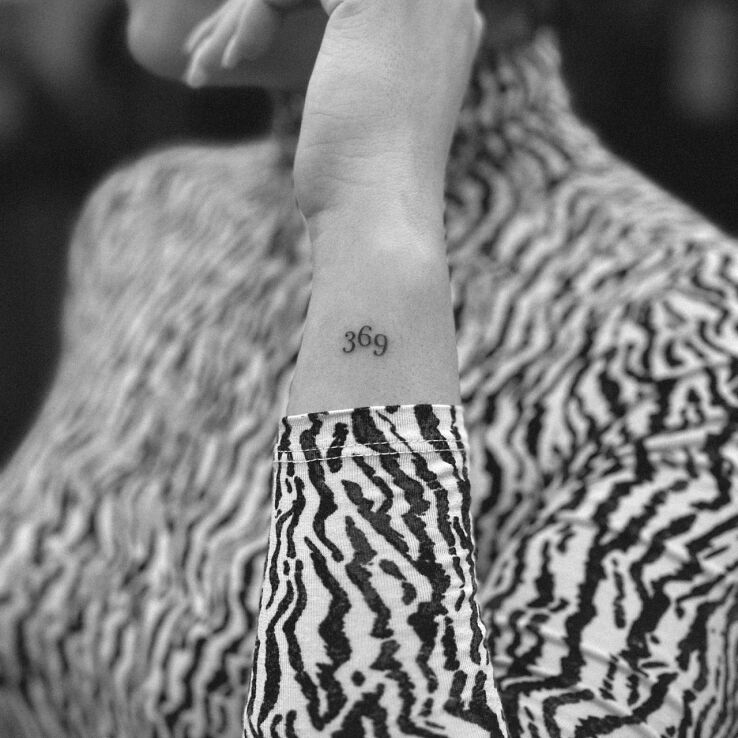 Tattoo 369 in minimalistic style on the wrist