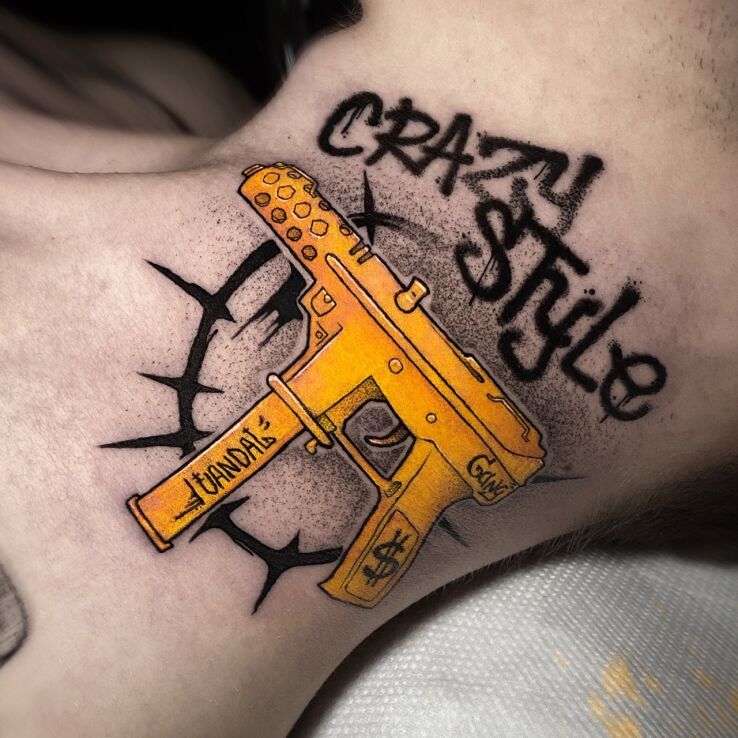 Tattoo Golden Gun in objects motif and graphic / illustrative style on the neck