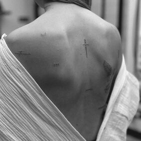 Tattoo A few small additions on the back motif: objects style: minimalistic