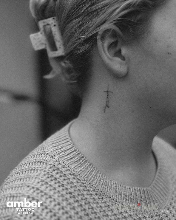 Tattoo Mini krzyżyk in małe motif and minimalistic style on the neck