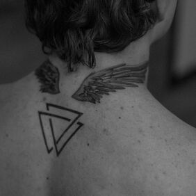 Tattoo Winged on the nape motif: black and gray style: graphic / illustrative