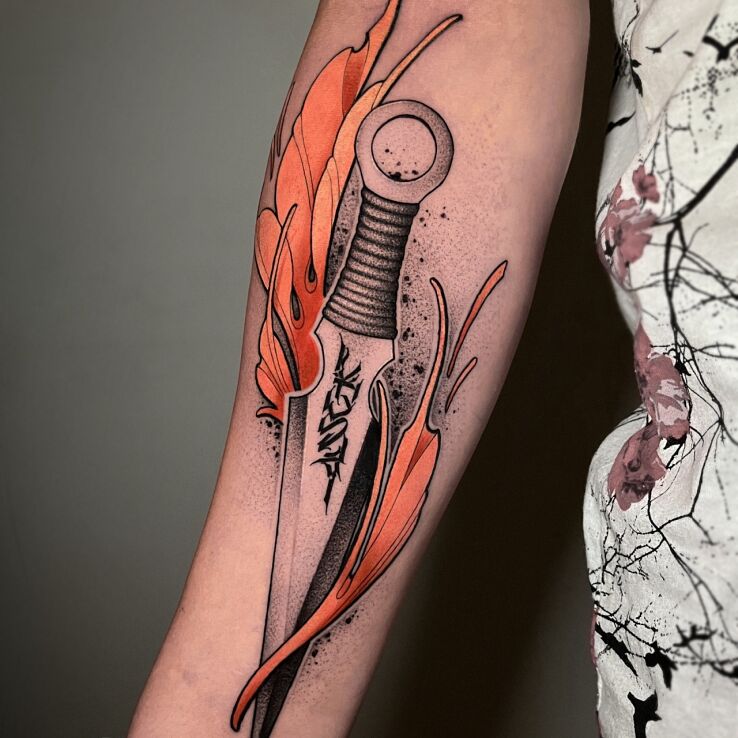 Tattoo Ninja blade in colorful motif and graphic / illustrative style On the arm