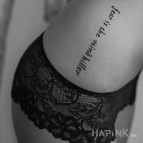 Tattoo Sexy caption on the ribs motif: lettering