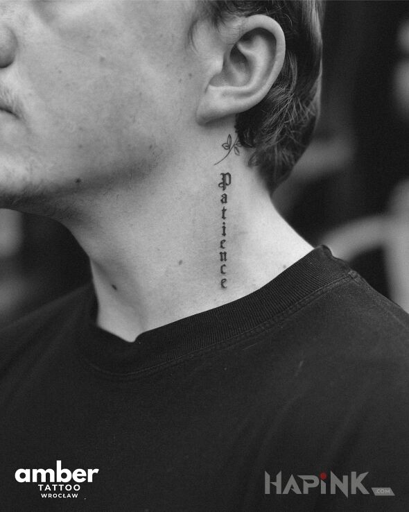 Tattoo Pionowe słowo in lettering motif and minimalistic style on the neck