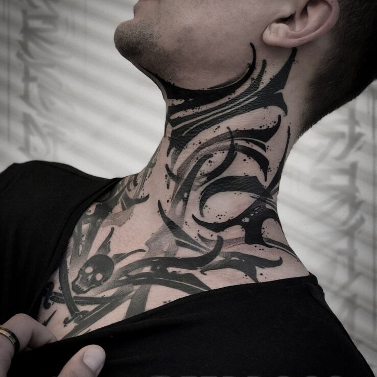 Tattoo Smudged Neck in skulls motif and blackwork / blackout style on the neck