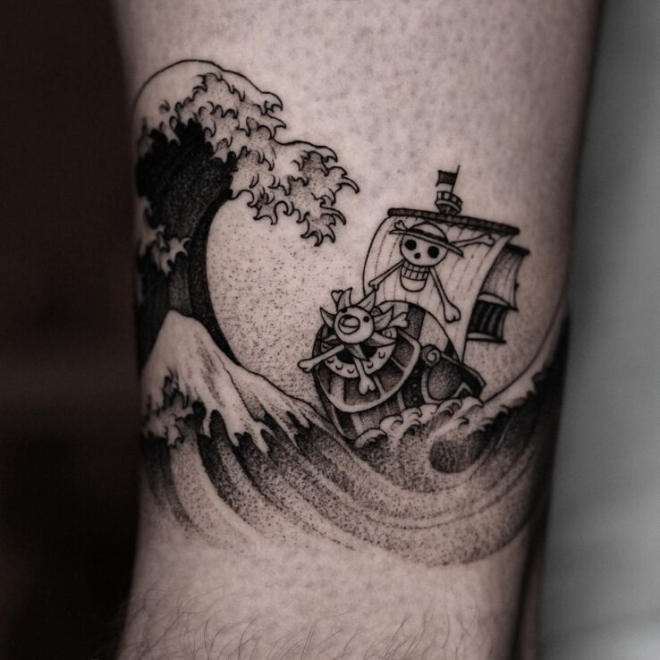 Tattoo Pirate ship in black and gray motif and graphic / illustrative style On the arm