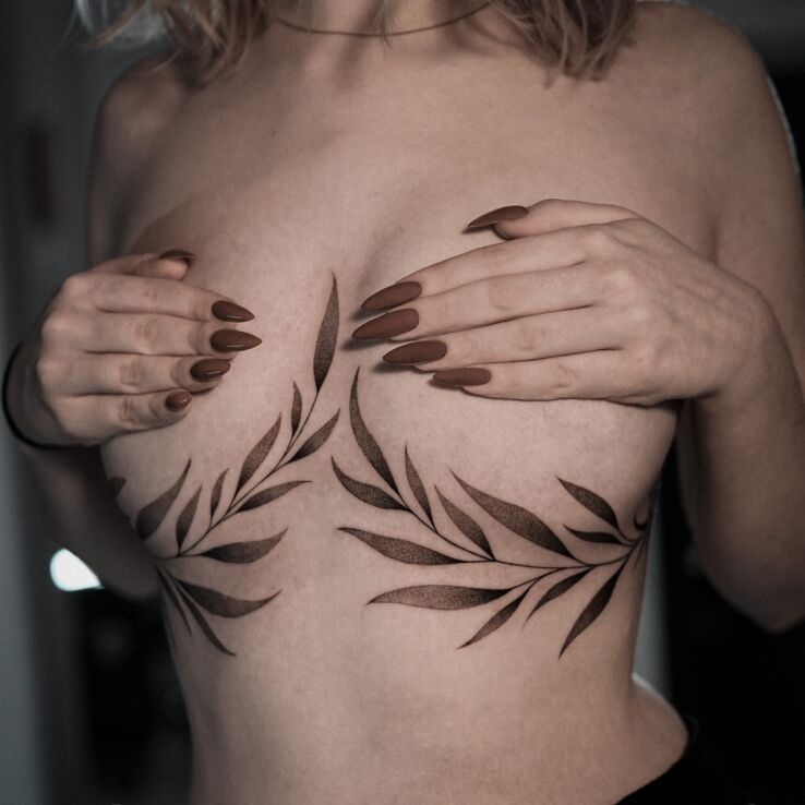 Tattoo Two Twigs in floral motif and graphic / illustrative style on the breast