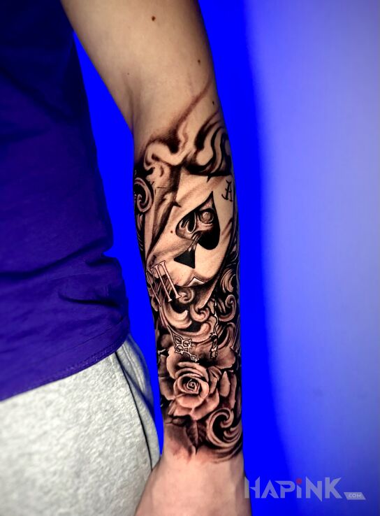Tattoo Tatuaż na przedramieniu czaszka, karta in other motif and realistic style On the arm