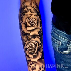 Tattoo Two roses and dog paws on the forearm motif: black and gray style: realistic