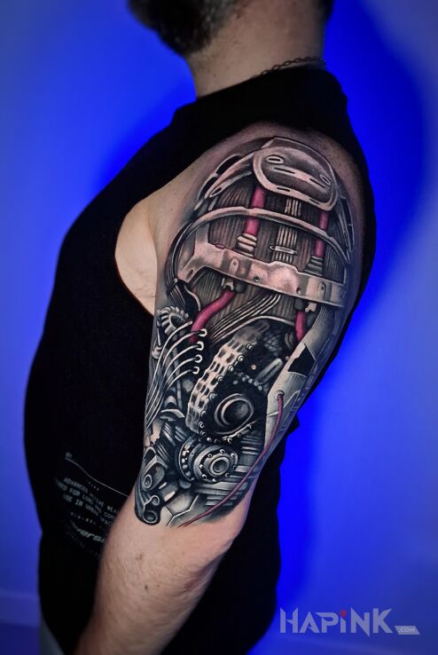 Tattoo Biomechaniczny tatuaż na ramieniu in 3D motif and realistic style on the upper arm