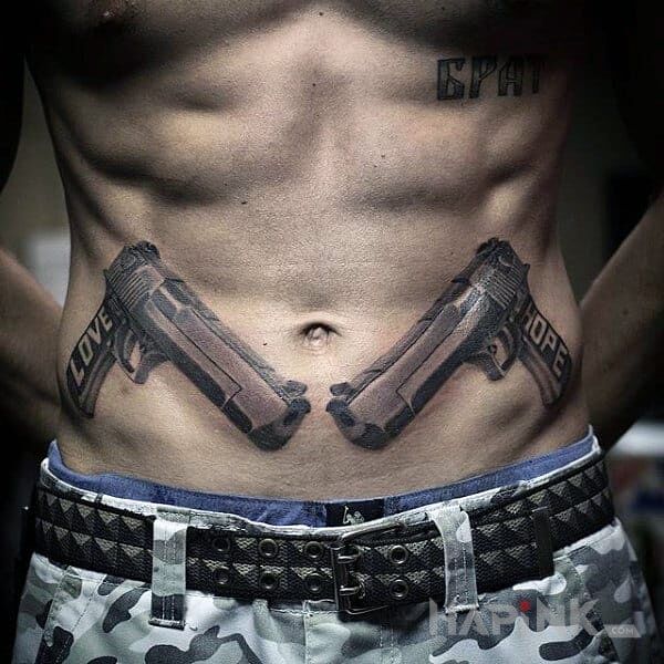 Tattoo Love & Hope in lettering motif and realistic style on the stomach