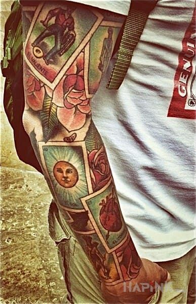Tattoo Karty in sleeves motif on the forearm
