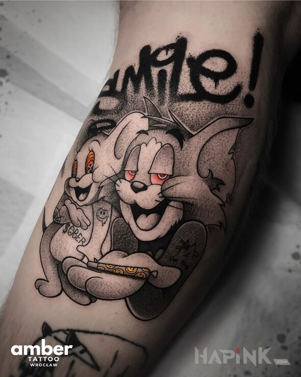 Tattoo Tom i Jerry z jointem in funny motif and dotwork style on the forearm