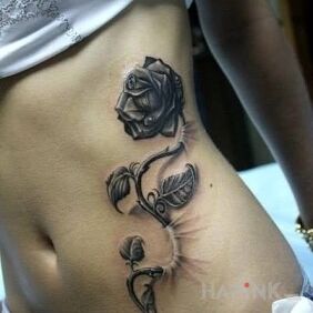 Tattoo Rose on the ribs motif: flowers style: realistic