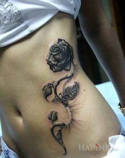 Tattoo Róża in 3D motif and realistic style on the ribs