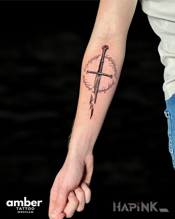 Tattoo Rękojeść miecza in black and gray motif and realistic style on the forearm