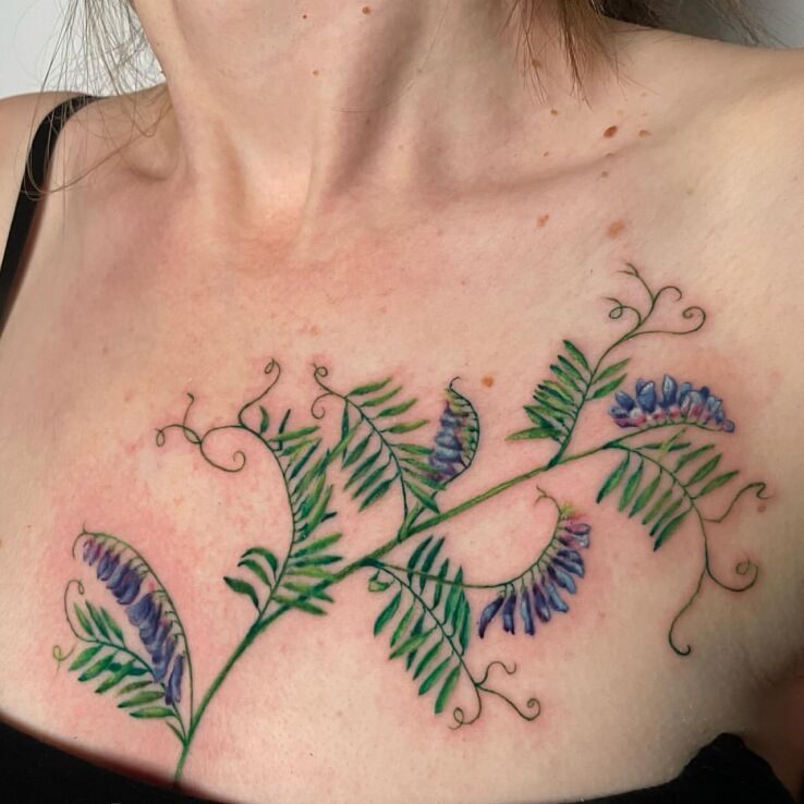 Tattoo Colorful Floristry in floral motif and realistic style on the breast