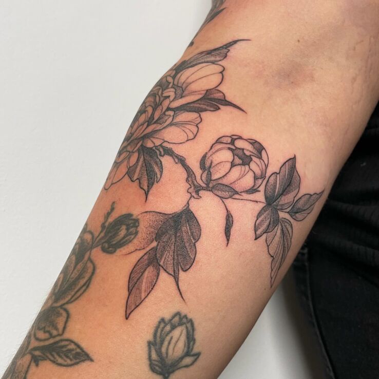 Tattoo Delicate flowers in flowers motif and graphic / illustrative style On the arm