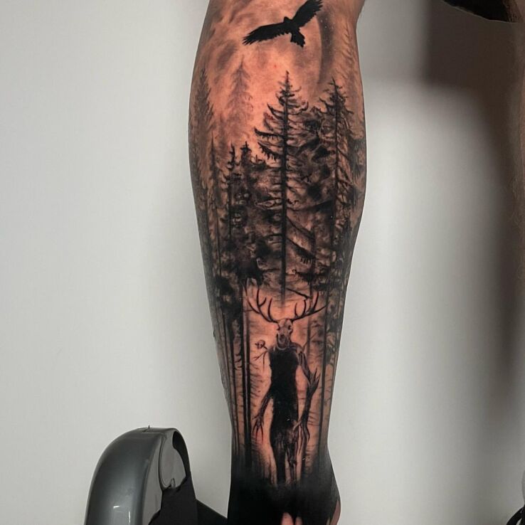 Tattoo Forest with mystical creatures in dark motif and realistic style on the leg