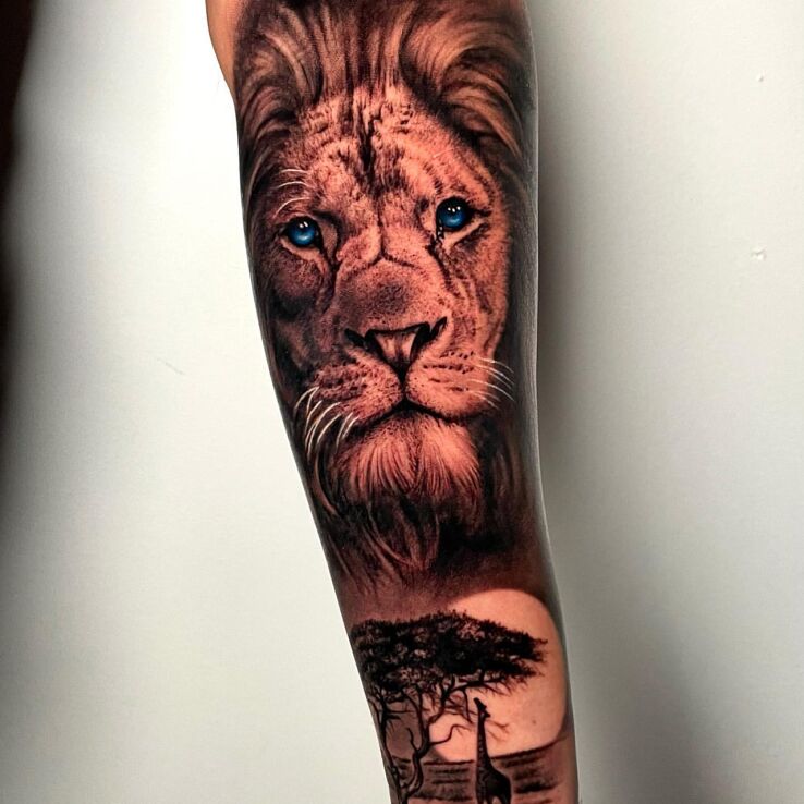 Tattoo Safari with lions in zodiac signs motif and realistic style on the forearm