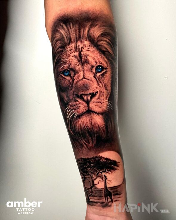 Tattoo Safari z lwami in black and gray motif and realistic style On the arm