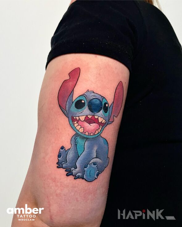 Tattoo Stitch in colorful motif and cartoon / comic book style on the upper arm