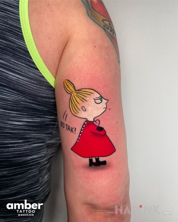 Tattoo Helga in colorful motif and cartoon / comic book style On the arm
