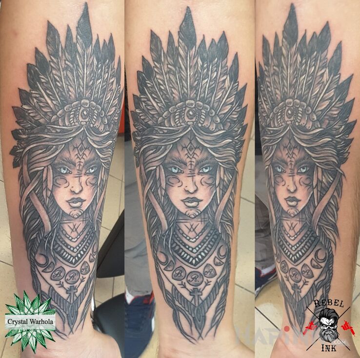 Tattoo Szamanka in characters motif on the forearm