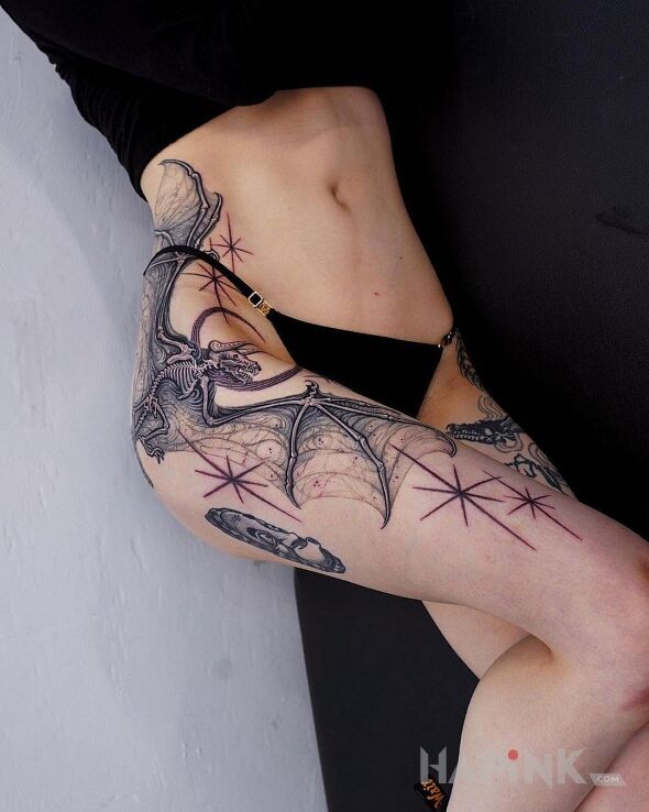 Tattoo Szkielet nietoperza in black and gray motif and realistic style on the thigh
